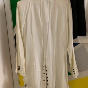 Three piece, white and black, a jacket and two mini skirts, one black one white